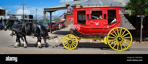 A panoramic format of a colorful antique stagecoach pulled by two
