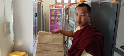 Image-04 Mahina, a Buddhist monk showing Tai Phake scripture