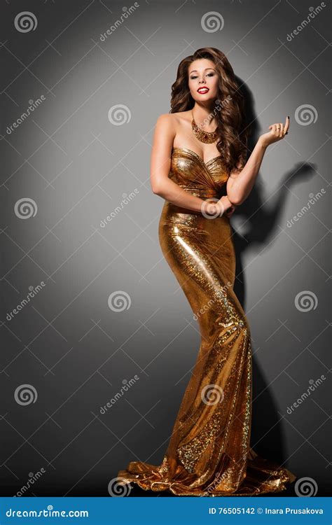 Elegant Woman In The Red Bikini On The Sun Tanned Slim And Shapely Body Is Posing Near The