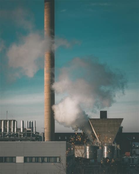 Premium Photo Smoke Emitting From Chimney Against Sky