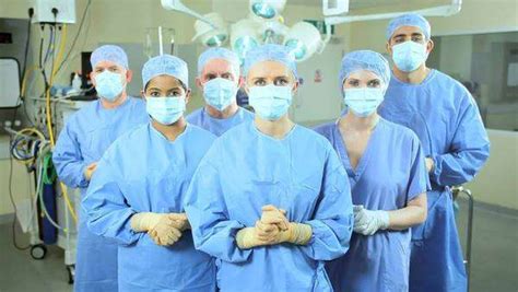 Portrait 6 Multi Ethnic Hospital Surgical Staff Dressed In Protective