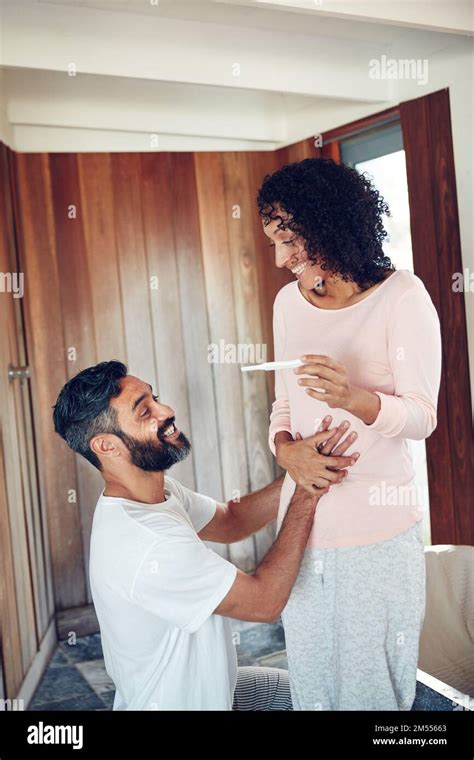 The Journey To Parenthood Begins A Mature Couple Feeling Happy After Taking A Home Pregnancy