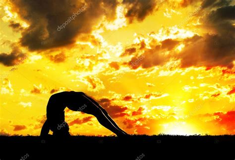 Yoga silhouette at sunset Stock Photo by ©byheaven 7388606