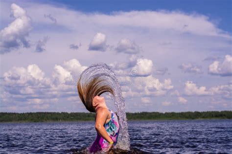 The Girl Frolics In The Water On A Hot Sunny Summer Day And Is Happy Stock Image Image Of