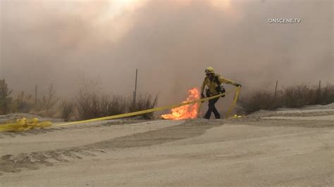 Wildfire torches structures in Southern California; thousands evacuated