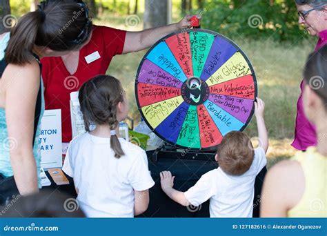 Child Spinning The Wheel Raffle In The Park Editorial Photo Image Of