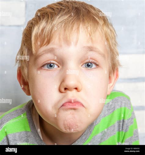 Portrait Of Adorable Sad Funny Child Stock Photo Alamy