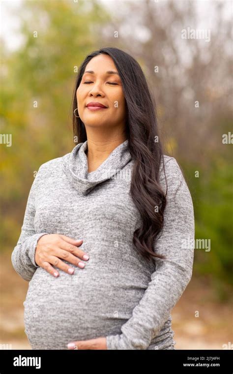 Happy Asian Pregnant Woman Holding Her Stomach Stock Photo Alamy