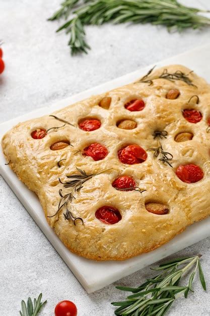 Premium Photo Focaccia Bread With Garlic Cherry Tomatoes Rosemary