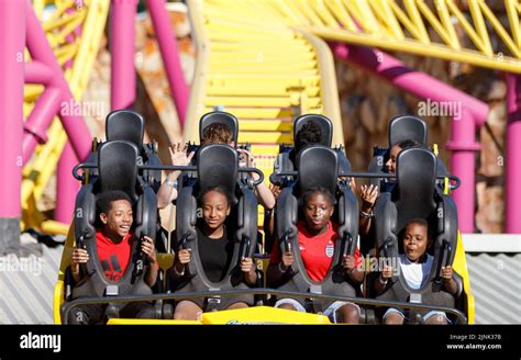 Roller coaster car with happy excited kids faces smiling and enjoying a ...