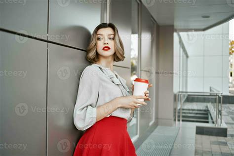 Attractive Blonde Woman In Red Skirt Cup Of Drink Outdoors Lifestyle