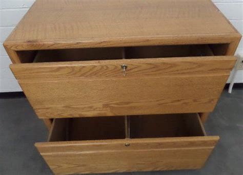 Lot Detail - OAK TWO DRAWER LOCKING LATERAL FILE CABINET WITH KEY