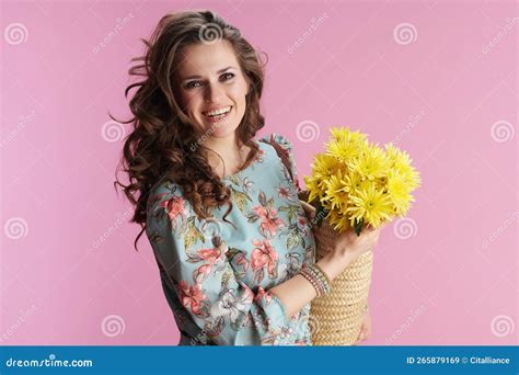 Portrait Of Smiling Modern Woman In Floral Dress On Pink Stock Image