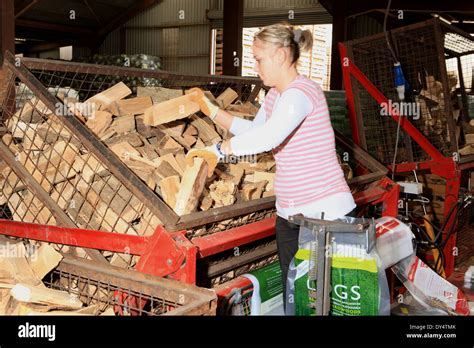 Woman Splitting Firewood Hi Res Stock Photography And Images Alamy