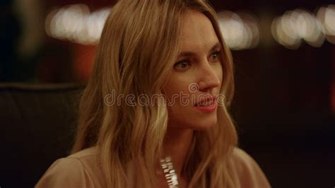 Blonde Girl Putting Spikelet At Hairstyle Portrait Romantic Woman Sitting Field Stock Photo