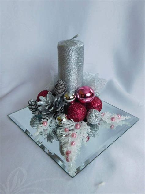 A Glass Plate Topped With Ornaments And A Candle