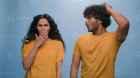 Multiracial shocked scared afraid couple amazed shocked Hispanic woman