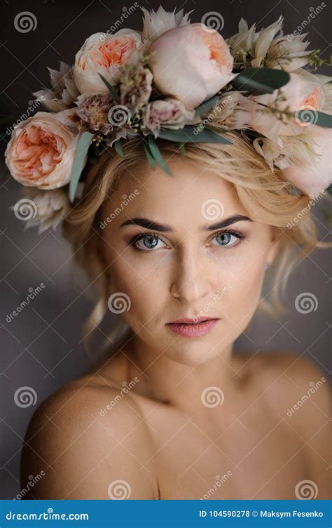 Nude Look Of Attractive Blonde Woman In A Floral Wreath Stock Photo