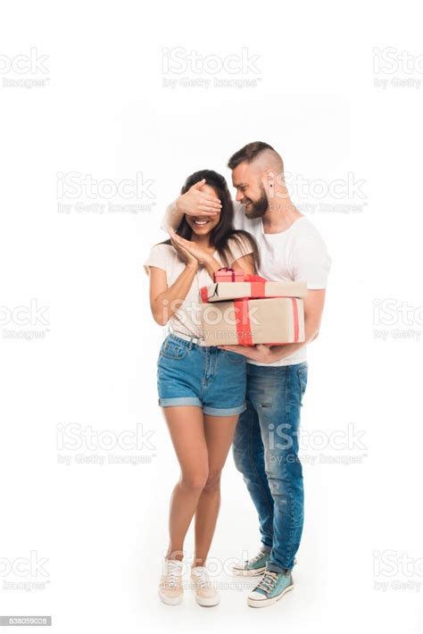 Portrait Of Young Attractive Man Surprising His Girlfriend By Ts