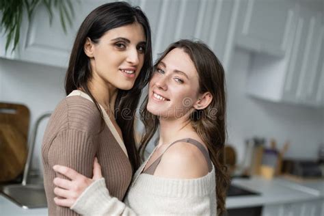 Smiling Lesbian Couple Hugging And Looking Stock Photo Image Of Love Girlfriends 260786582