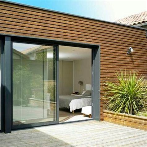 An Open Patio With Sliding Glass Doors Leading To A Bedroom And Outside