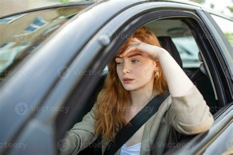 Nervous Female Driver Sits At Wheel Has Worried Expression As Afraids To Drive Car By Herself