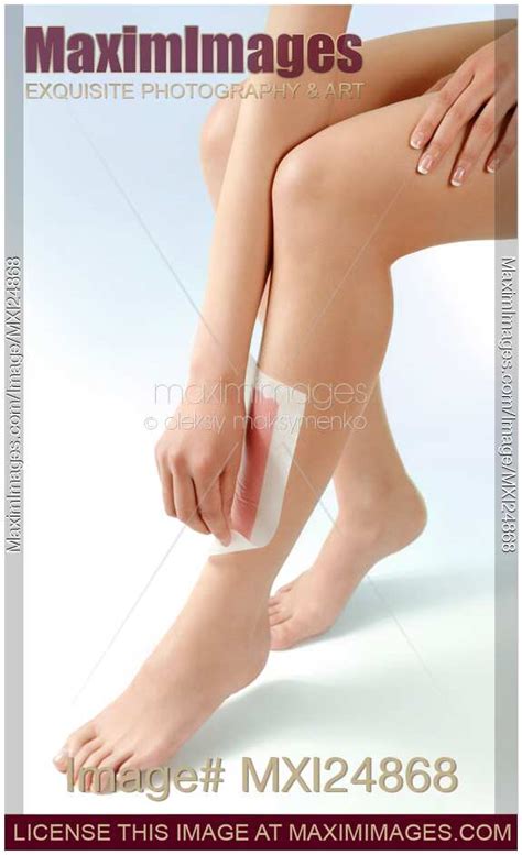 Stock photo: Woman waxing her legs | MaximImages | Image #MXI24868