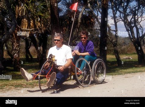 Disabled Man Takes Able Bodied Wife For Ride Stock Photo - Alamy 