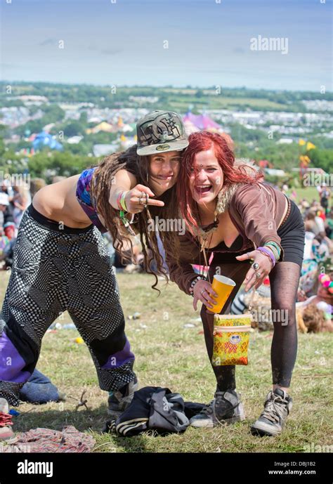 Glastonbury Festival 2013 Uk Two Girls Strike A Pose Near The Stone