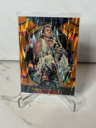 Brutus Beefcake 2023 Panini Select WWE Orange Flash Prizm Concourse 97