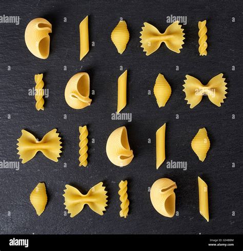 Various Types Of Pasta On Black Stone Table Top View Stock Photo Alamy