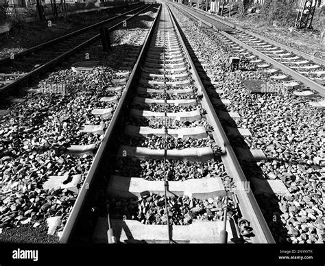 Railroad Tracks Photographed In Black And White Stock Photo Alamy