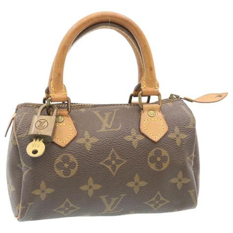 Louis Vuitton Nano Speedy Brown Cloth Ref Joli Closet