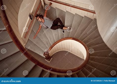 Young Man Falling Down The Steep Stairs Stock Photo - Image: 33728526