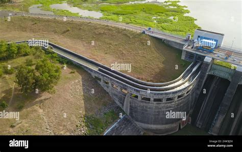 Water In Dam Concrete Spillway Infrastructure At Reservoir Waterfall