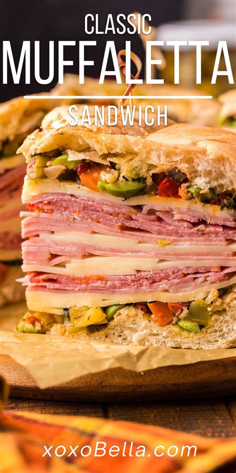 A Well Made Muffaletta Sandwich With Olive Spread Deli Meats And