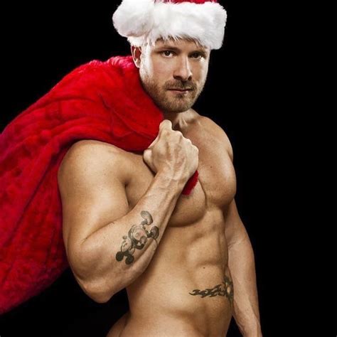 A Naked Man Wearing A Santa Claus Hat