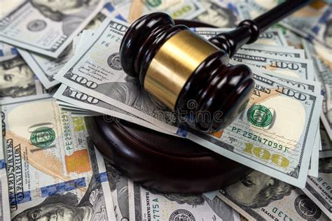 Large Amount Of Dollar Money And A Judge S Gavel On The Table Isolated