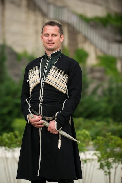 Premium Photo Man In Georgian National Dress On A Background Of Mountains