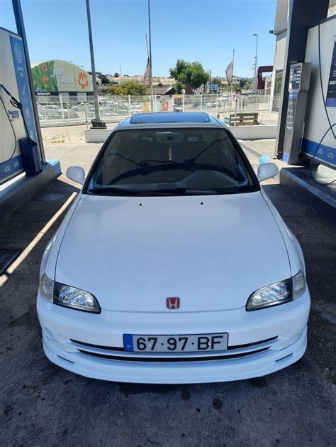 White Car Parked At Gas Station