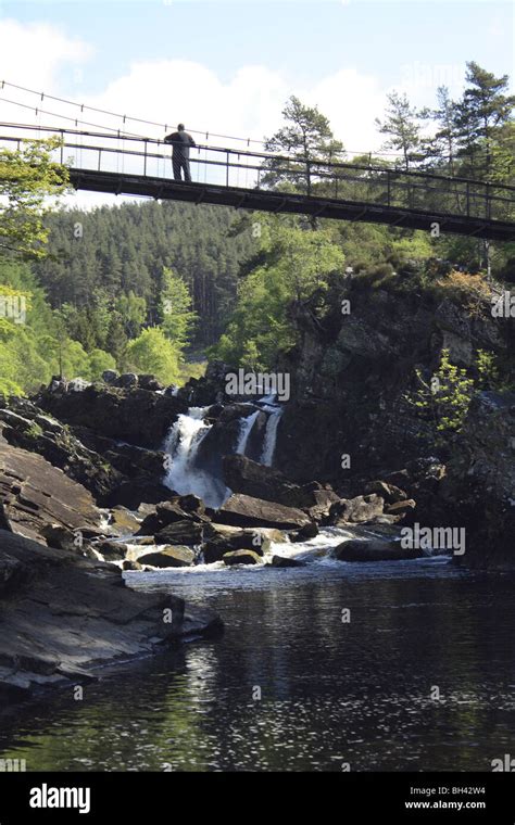 Rogie Falls On The Blackwater River With Suspension Bridge Stock Photo