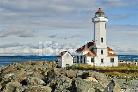 Point Wilson Lighthouse And Rocky Shore Stock Photo Royalty Free