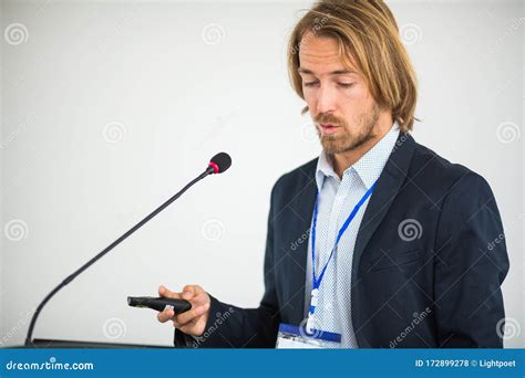 Young Man Giving A Speech At A Conference Stock Photo Image Of