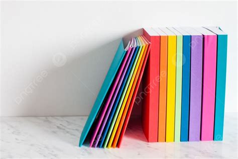 Colorful Books Are Outlined In The Colors Of The Rainbow Stacked Of The Books On A Shelf Near ...