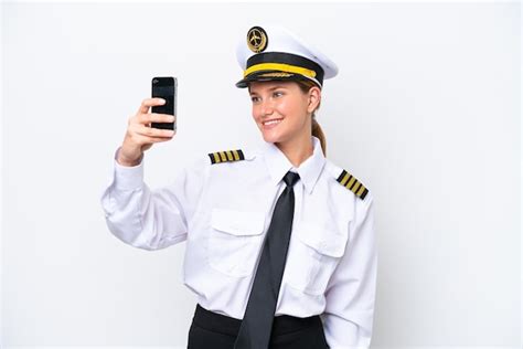 Premium Photo | Airplane caucasian pilot woman isolated on white background making a selfie