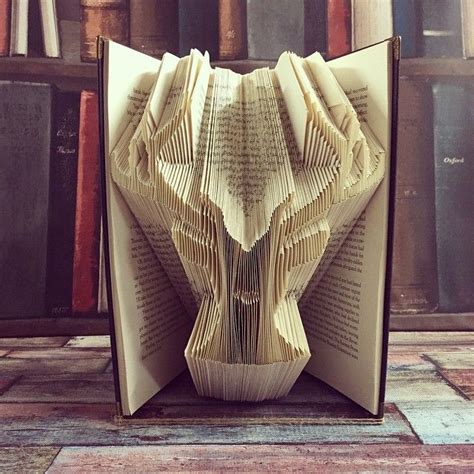 Artist Repurposes Old Books Into 3D Sculptures By Carefully Folding