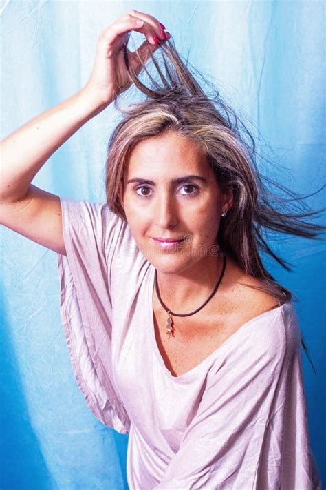 Mature Woman Shows Off Her Blonde Hair With Renewed Color After