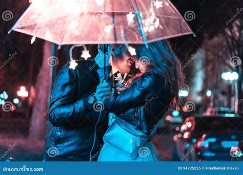 Guy And Girl Kissing Under An Umbrella Stock Image Image Of Lovers