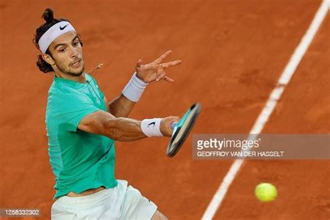 Italy's Lorenzo Musetti plays a forehand return to Russia's Alexander ...