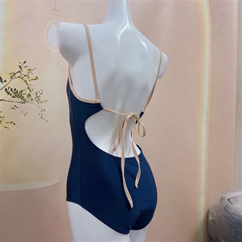 BIKINI LOẠI Bikini nữ liền mảnh đồ bơi nữ đi biển khoét lưng màu xanh đen viền dây BE cột